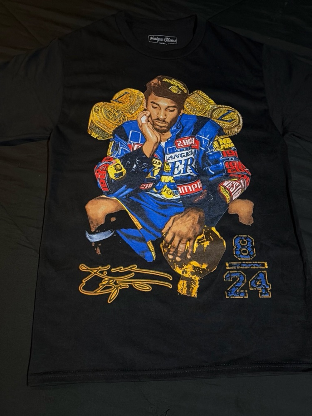 Black Short‑Sleeve Graphic Tee with Multicolor Athletic Print